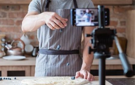 Man records himself cooking with phone thumbnail hero image